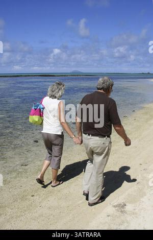 Elderly couple walking on the beach in Mauritius, Cap Malheureux, Mauritius, Africa Stock Photo