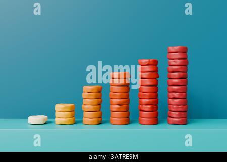 A rising bar chart made of play dough on a blue background. High quality photo Stock Photo