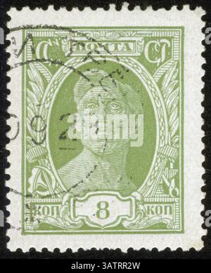 SOVIET UNION - CIRCA 1929: A stamp printed by the Soviet Union Post shows a worker, circa 1929 Stock Photo