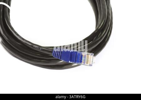 Network cable on light background Close up of a network plug on light background Stock Photo