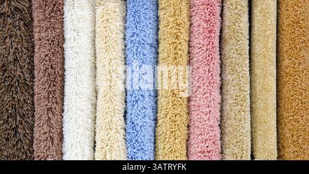 Different colourful artificial shaggy carpet samples, closeup Stock Photo