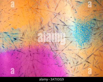 Abstract background with vibrant colors and textures, featuring splashes of pink, orange, and blue with scattered lines and patterns. Stock Photo