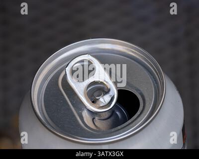 Close-up of an opened aluminum beverage can with a pull tab. Stock Photo