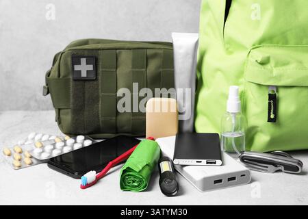 Survival kit. Different emergency supplies on light table Stock Photo