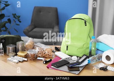 Survival kit. Different emergency supplies on wooden table indoors Stock Photo