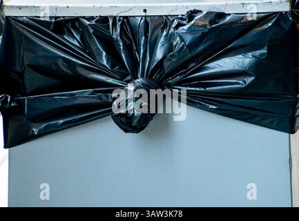 Trash bag tied to the bin Stock Photo