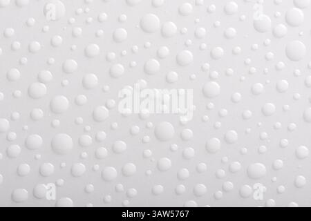Close up water drops on white background. Top view. Stock Photo