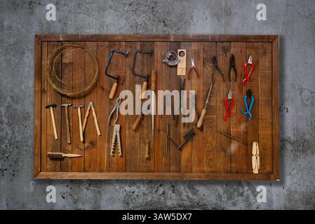 Tools on wall hanging at a carpentry workshop. High quality photo Stock Photo