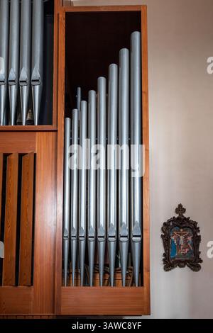 Old organ with a score and pipes, in a church in Spain Stock Photo