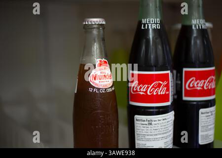 Los Angeles, California, United States - 10-02-2021: A view of glass bottles of Coca-Cola and Sidral Mundet soda. Stock Photo