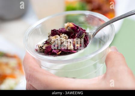 A view of a spoonful of dried rose hips. Stock Photo