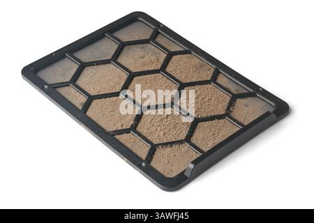 clogged removable or built in screen air filter of computer case isolated white background, fine mesh screen with hexagonal grid trapped with layer Stock Photo