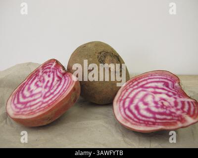 One whole and one halved Chioggia ringlet on paper Stock Photo
