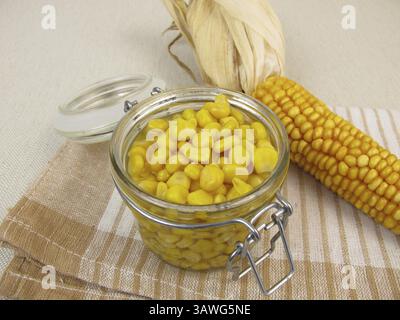 Cooked corn kernels in a jar Stock Photo