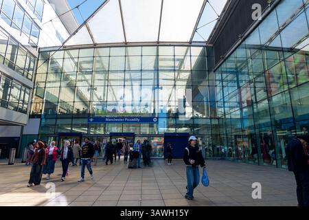 Manchester Piccadilly Train station entrance with passengers entering and exiting the station. Stock Photo
