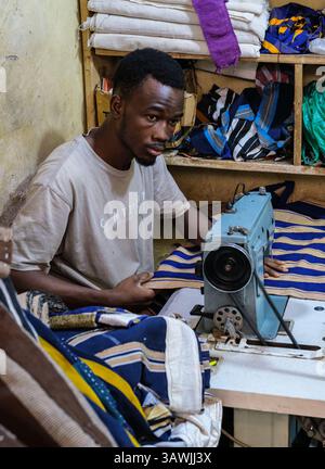 Ghana, Tamale. Tailor Working in his Shop in the Central Market. Stock Photo