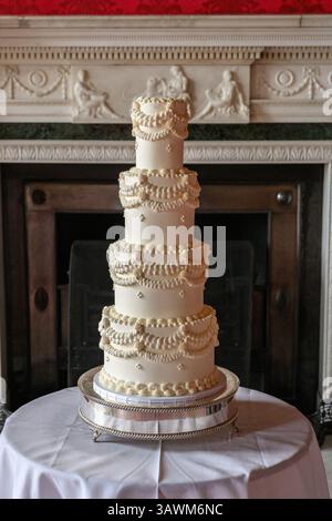 Ornate four tier buttercream wedding cake Stock Photo
