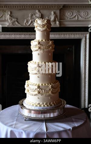 Ornate four tier buttercream wedding cake Stock Photo