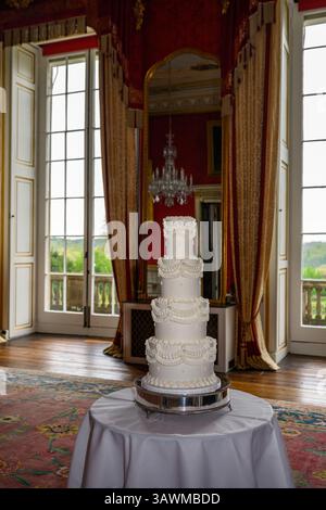 Ornate four tier buttercream wedding cake Stock Photo
