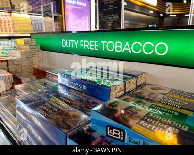 duty free tobacco prices 2024 variety of products, display of various brands of cigarettes, including Raison French Lemon and Winston, Phnom Penh Central market Stock Photo Tobacco & Cigarette State Excise