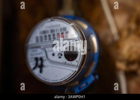 Close Up of Water Meter with Transparent Cover and Blue Housing Stock Photo