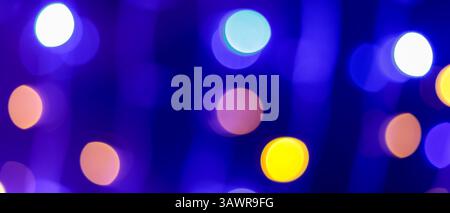 Blurred Abstract Background with Blue, Purple and Orange Bokeh Circles, Vibrant Festive Glow Stock Photo