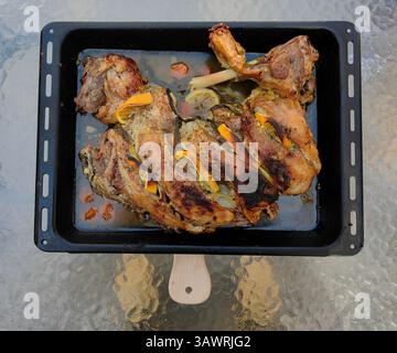 Easter Roast: Lamb in Black Pan on Crystal Matte Table Stock Photo