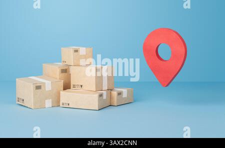 Stack of Delivery Boxes and Red Location Pin on Blue Background Stock Photo