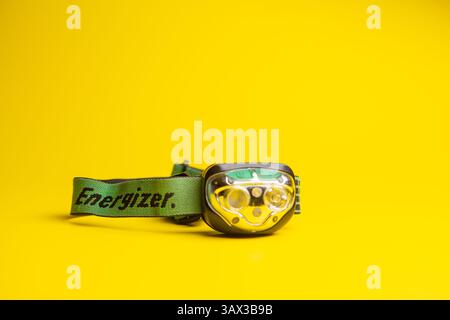 Rechargeable Energizer headlamp on a yellow  background Stock Photo