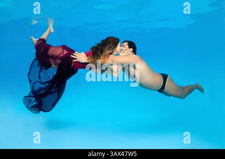 October 15, 2014 - Odessa, pool, Ukraine - Man and woman kissing under water, Underwater fasihon in the pool, Odessa, Ukraine (Credit Image: © Andrey Nekrasov/ZUMA Wire/ZUMAPRESS.com) Stock Photo
