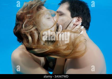 October 15, 2014 - Odessa, pool, Ukraine - Man and woman kissing under water, Underwater fasihon in the pool, Odessa, Ukraine (Credit Image: © Andrey Nekrasov/ZUMA Wire/ZUMAPRESS.com) Stock Photo