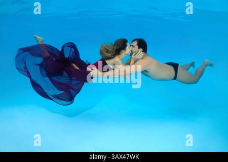 October 15, 2014 - Odessa, pool, Ukraine - Man and woman kissing under water, Underwater fasihon in the pool, Odessa, Ukraine (Credit Image: © Andrey Nekrasov/ZUMA Wire/ZUMAPRESS.com) Stock Photo