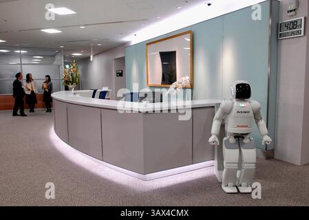 Honda Motor Co.'s humanoid robot ASIMO stands by the reception of an office during a media demonstration of Honda's new intelligence technologies, whi Stock Photo