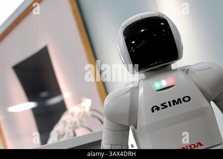 Honda Motor Co.'s humanoid robot ASIMO stands by the reception of an office during a media demonstration of Honda's new intelligence technologies, whi Stock Photo