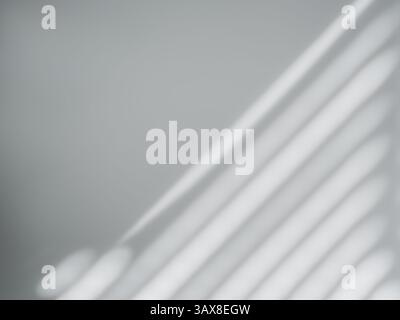 Abstract blurred and soft of diagonal stripe line pattern light and shadow lines from blinds or shades & shutters on grey wall background, black and w Stock Photo