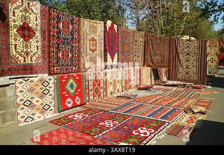 Eye-catching Various Patterns of Carpets for Sale at Vernissage Market in Downtown Yerevan, Armenia Stock Photo