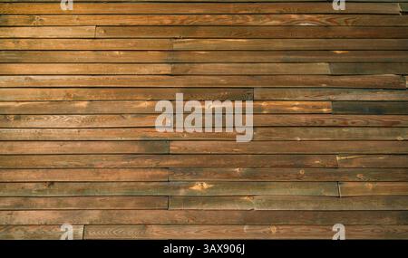 Wooden wall cladding. Wooden wall texture. Brown wood timber surface Stock Photo