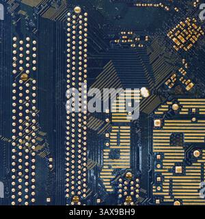 Detail of the back of a motherboard. Circuits and welds Stock Photo