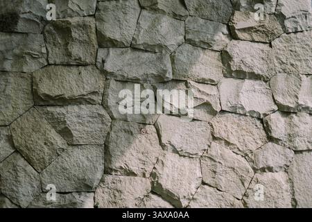 A close up of a strong, durable stone cladding wall. A textured background. Stock Photo