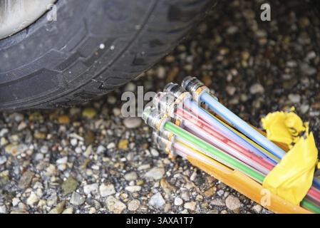 Fibre optic connection on car tyres and fast internet connection - close-up technology Stock Photo