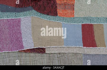 Knitted mosaic makes a colourful patchwork quilt Stock Photo