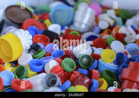 Coloured screw caps from PET plastic bottles - Recycling Stock Photo