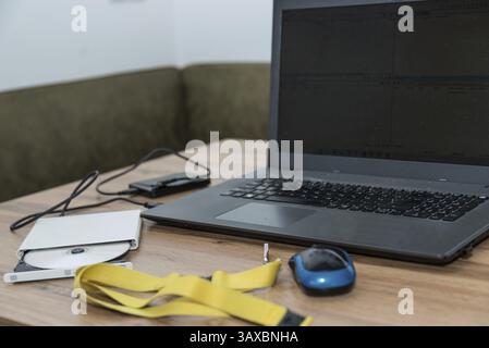 Laptop with external storage media - DVD, USB stick and external hard drive Stock Photo
