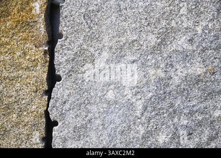 Close-up of grey and brown granite - natural stone as a building material, background Stock Photo