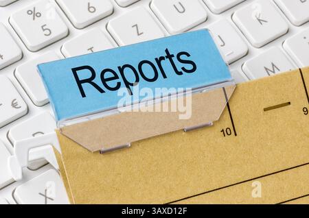 A brown file folder labeled with Reports Stock Photo