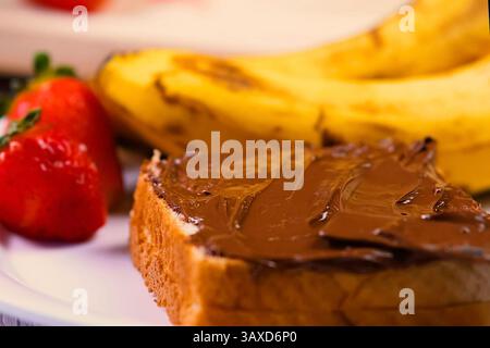 Chocolate spread spread on bread. Morning breakfast Stock Photo