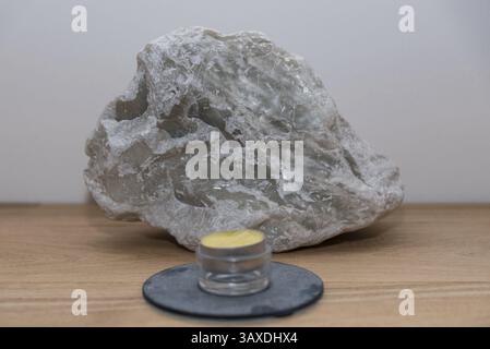 Decorative soft craft stone soapstone and scented candle - talc stone Stock Photo
