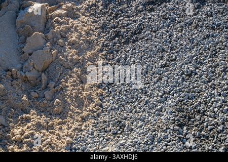 Construction rubble and sand on a sunny day close-up. Stock Photo