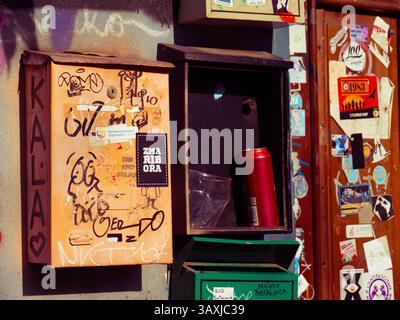 Graffiti-Decorated Postal Boxes on a Colorful Urban Wall, Metelkova, Ljubliana, Slovenia Stock Photo