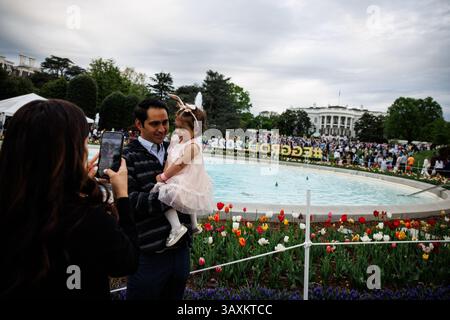 A family poses for a photo during the 2025 Easter Egg Roll on the South Lawn of the White House on April 21, 2025 in Washington, DCCredit: Samuel Corum/Pool via CNP/MediaPunch Stock Photo